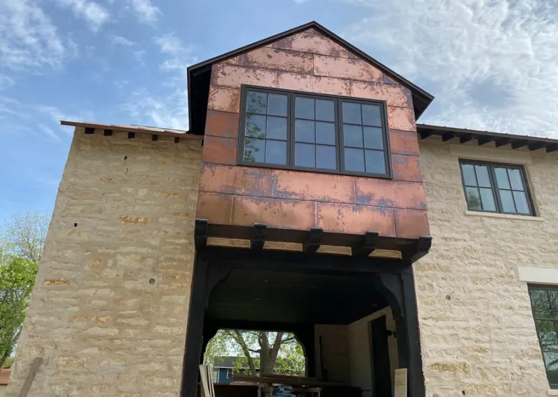 Copper metal panel facade on a stone building for Metal Roof Coating in Shreveport
