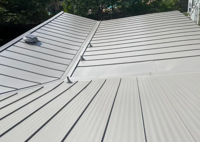 Solar attic fan installed on a metal roof for Roof Ventilation in Shreveport